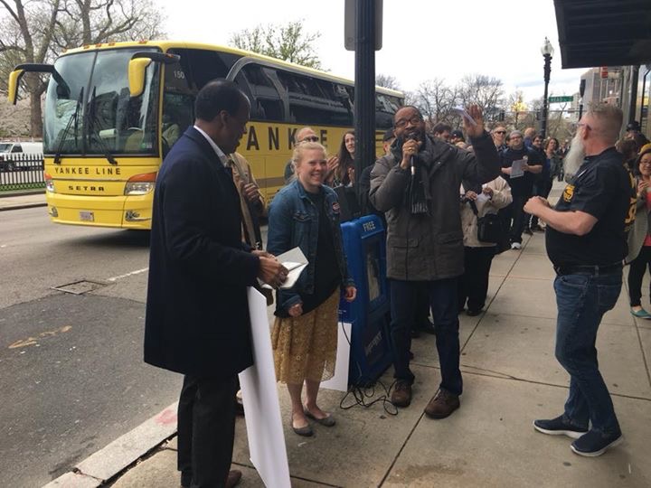 Union members chatting with President Lee Pelton outside the Ansin building.